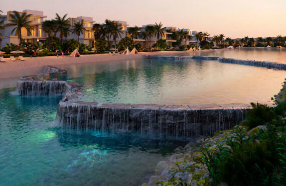 Tropical water features and man-made waterfalls within the DAMAC Islands residential community.