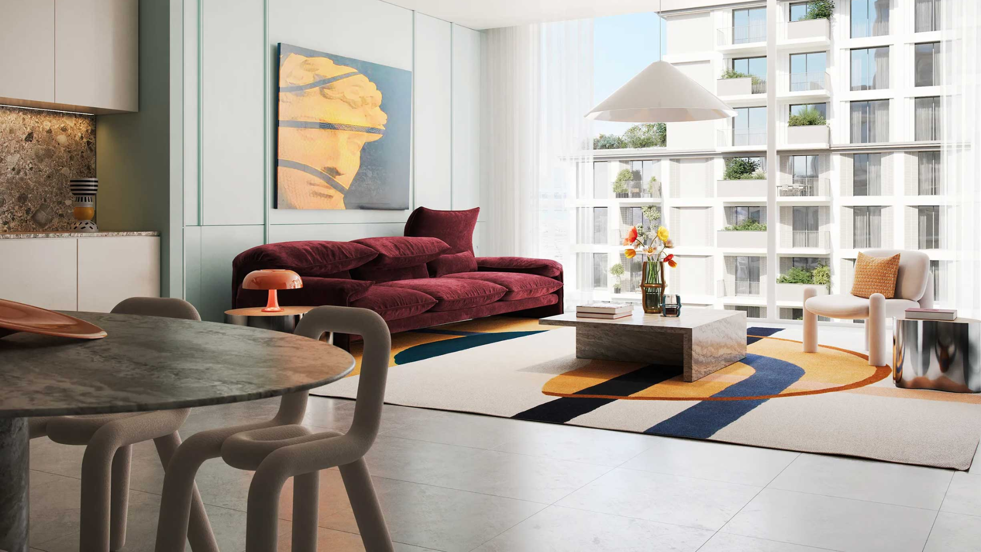 Modern living room with bold furniture, large windows, and city views