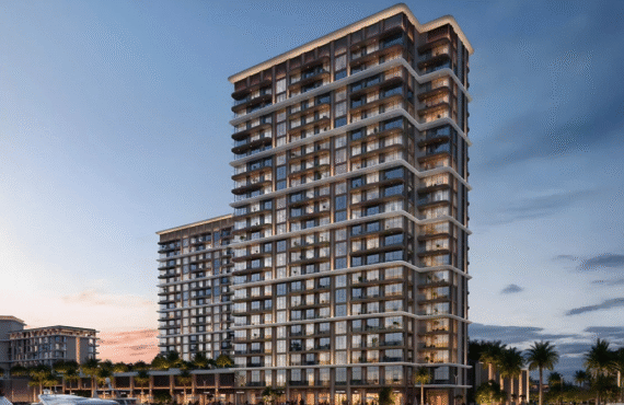 BAYSTAR residential building overlooking a marina with yachts at sunset.