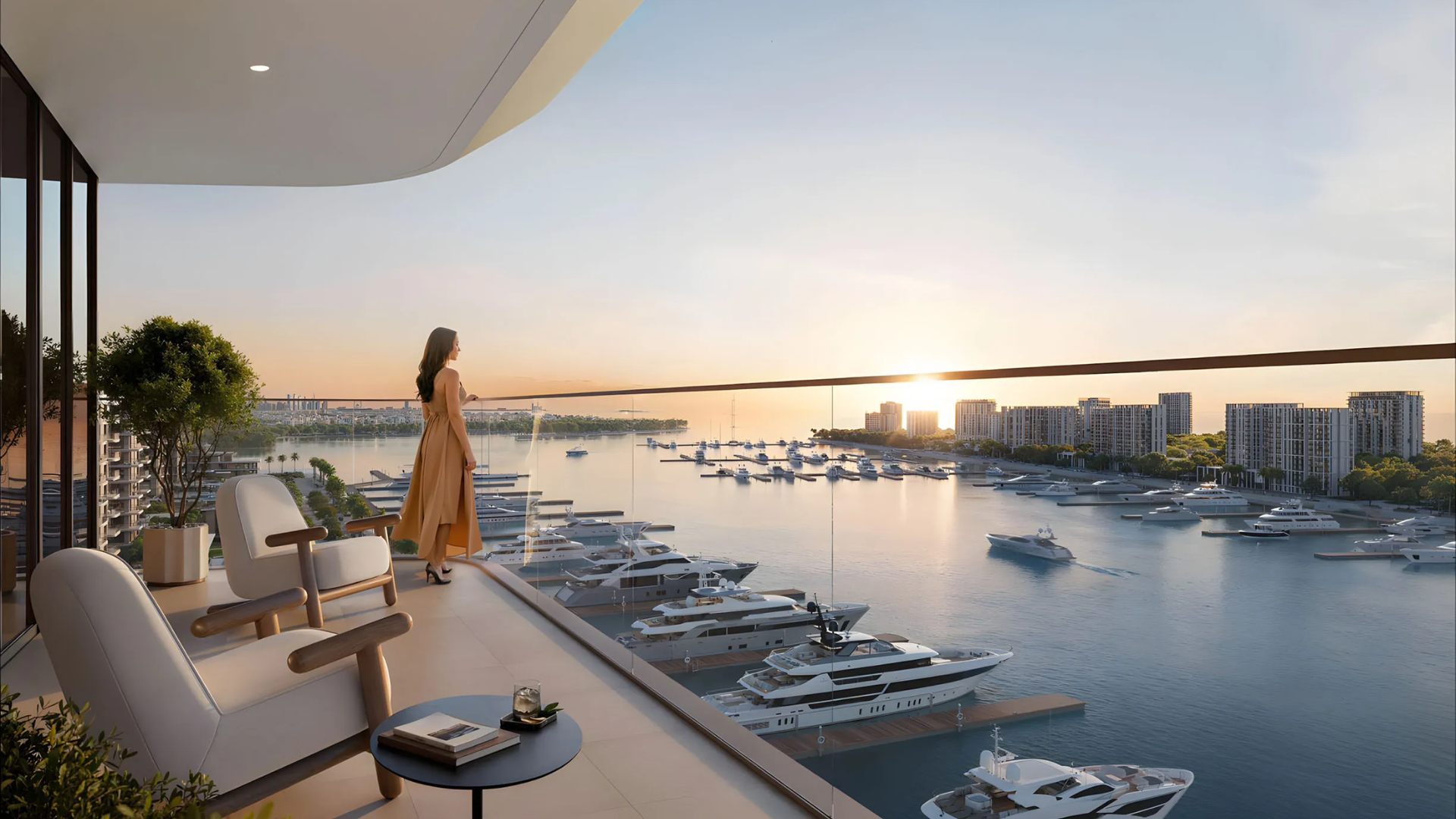 Modern residential building overlooking a marina filled with boats at sunset