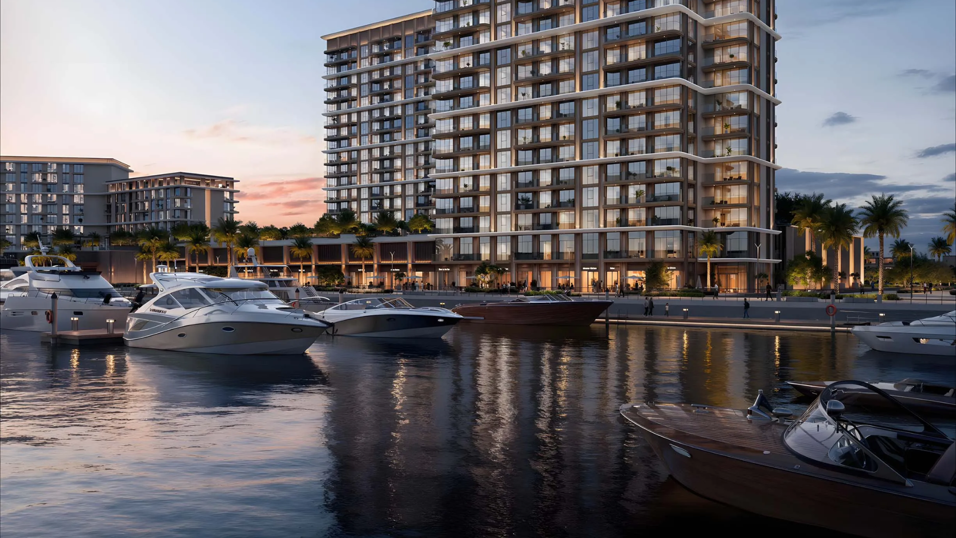 Modern high-rise building alongside a bustling marina with docked yachts.