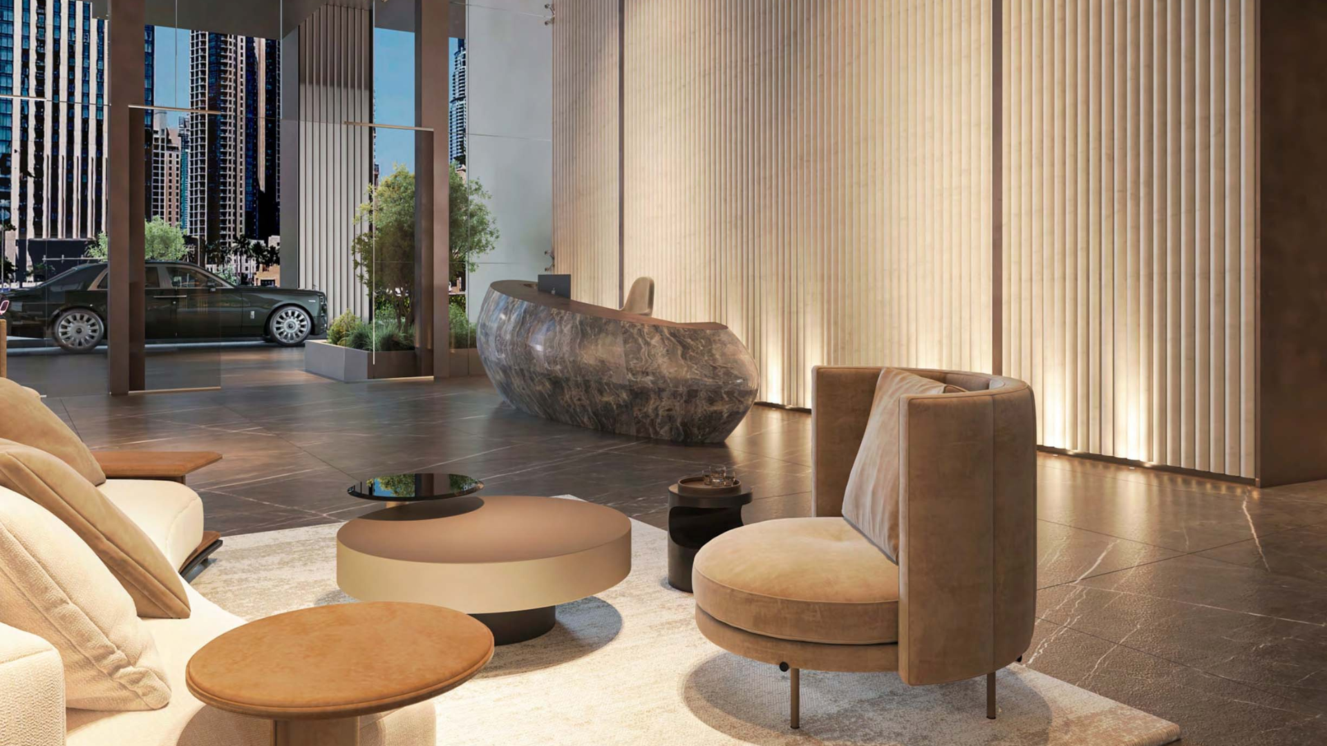 Lobby with modern seating, sculpted reception, and glass entrance