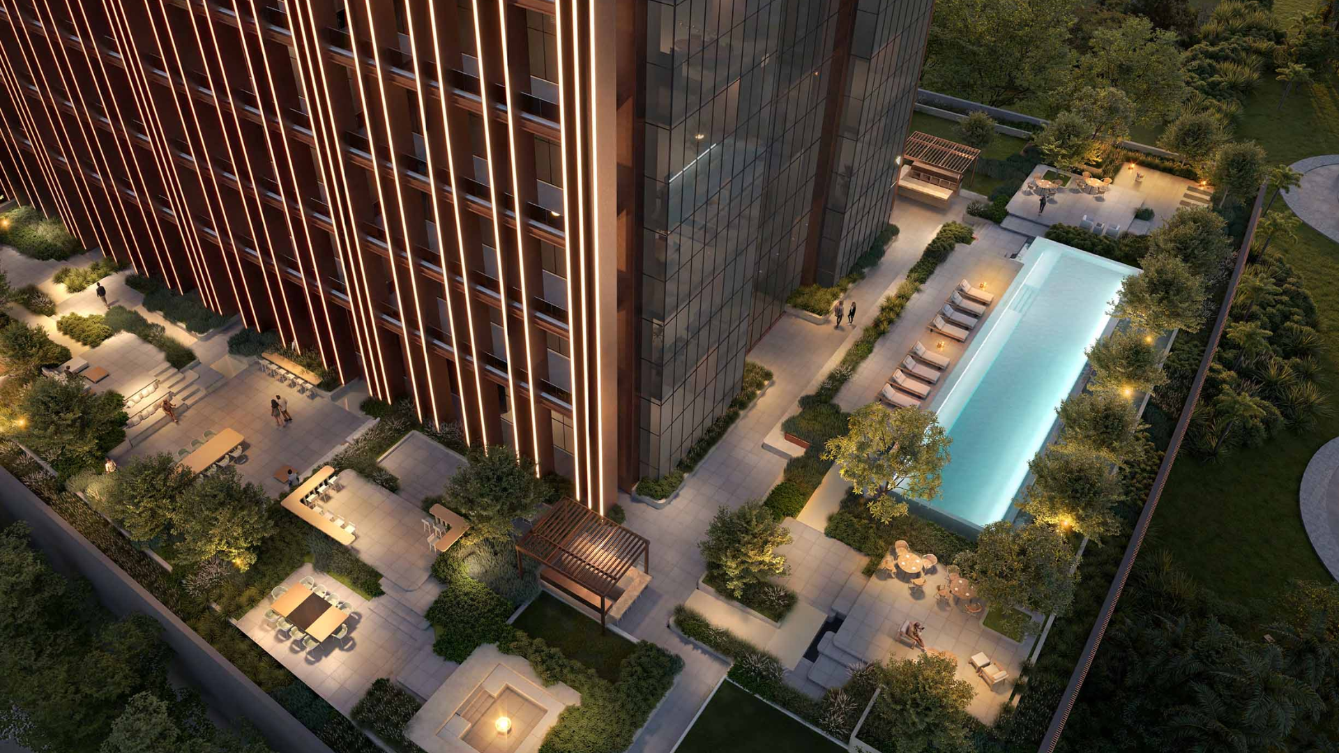 Aerial shot of leisure deck with pool, lounge chairs, and greenery