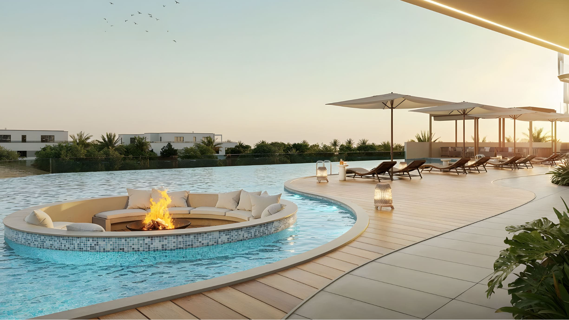 Infinity pool at Ocean Bay Dubai with fire pit lounge and sunset view
