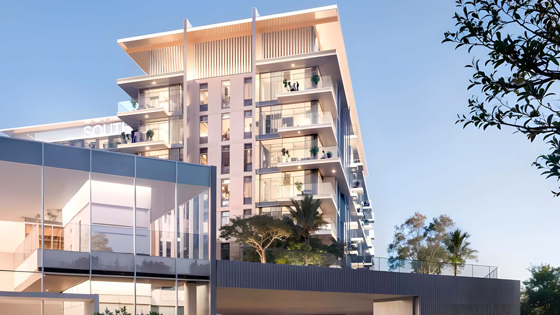 Corner perspective of sleek high-rise building with private balconies