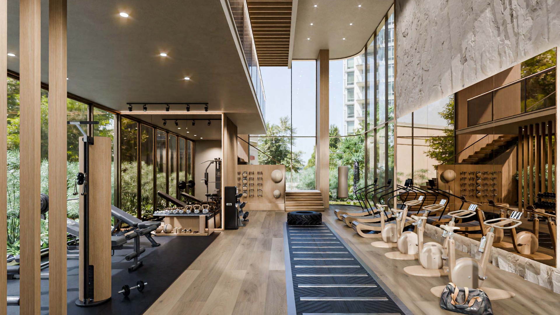 Bright workout space featuring large windows and minimalist design