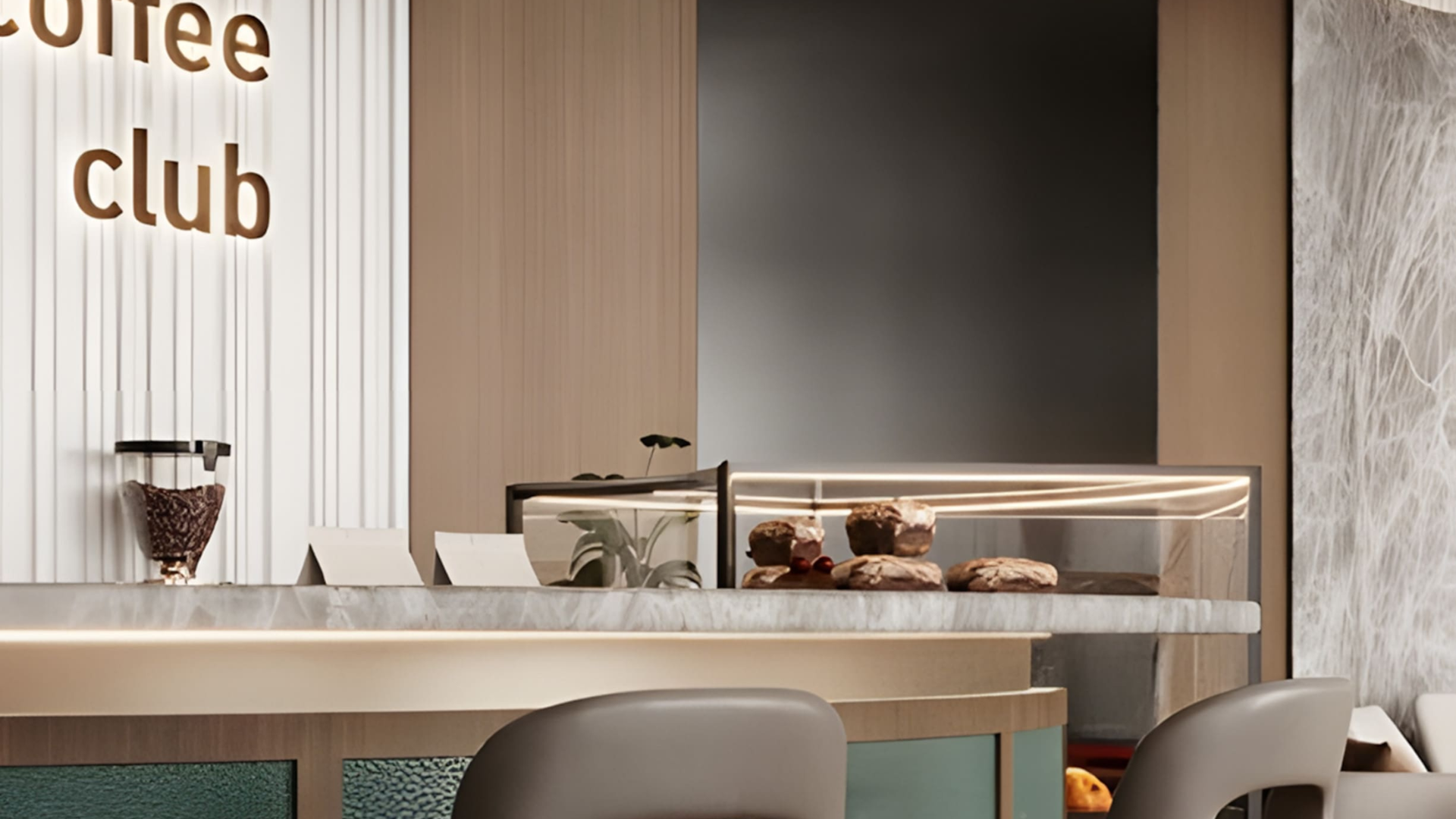 Elegant café counter at V-SUITES with pastries on display