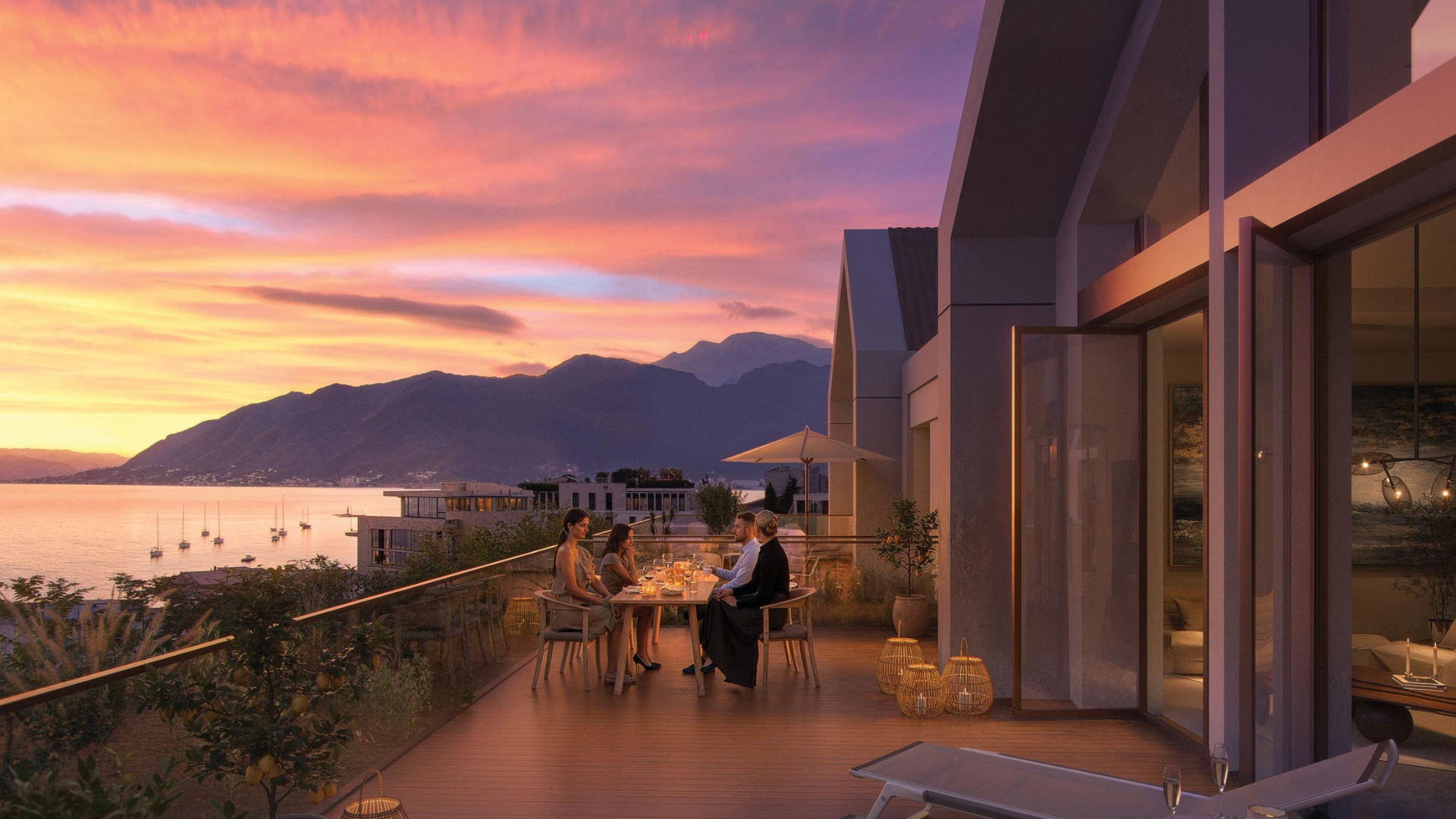 Elegant terrace dining at sunset with panoramic mountain and sea views