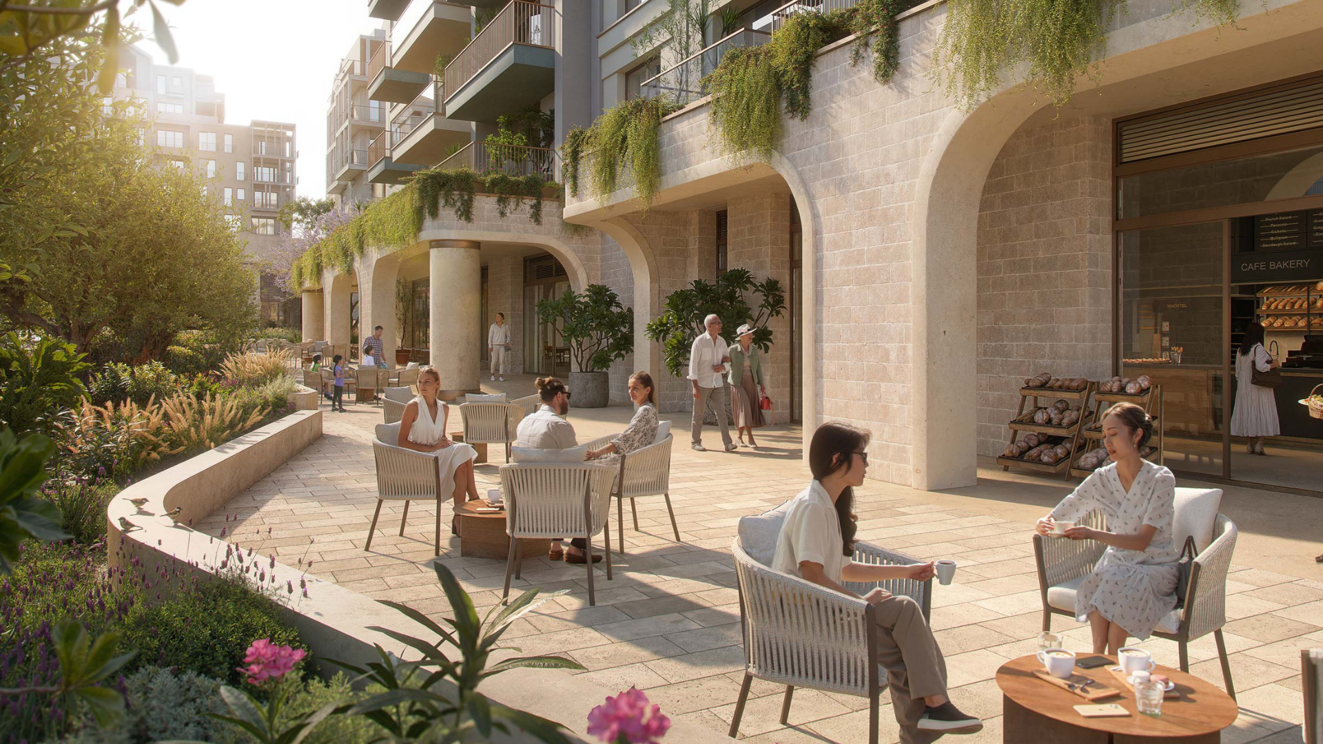 Group enjoying a candlelit dinner on a modern waterfront balcony during twilight