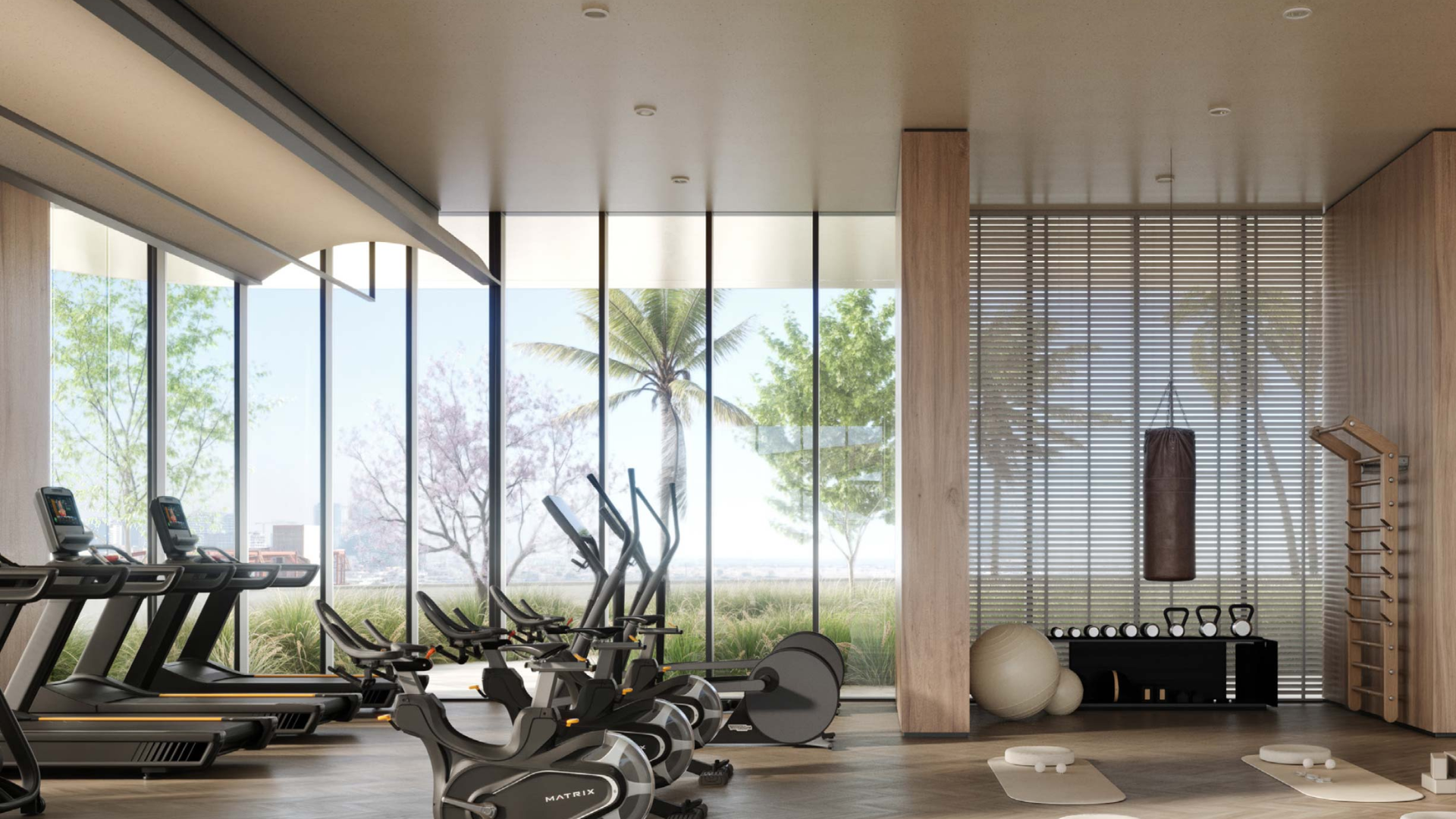 Spacious gym area with floor-to-ceiling mirrors and high-end workout equipment