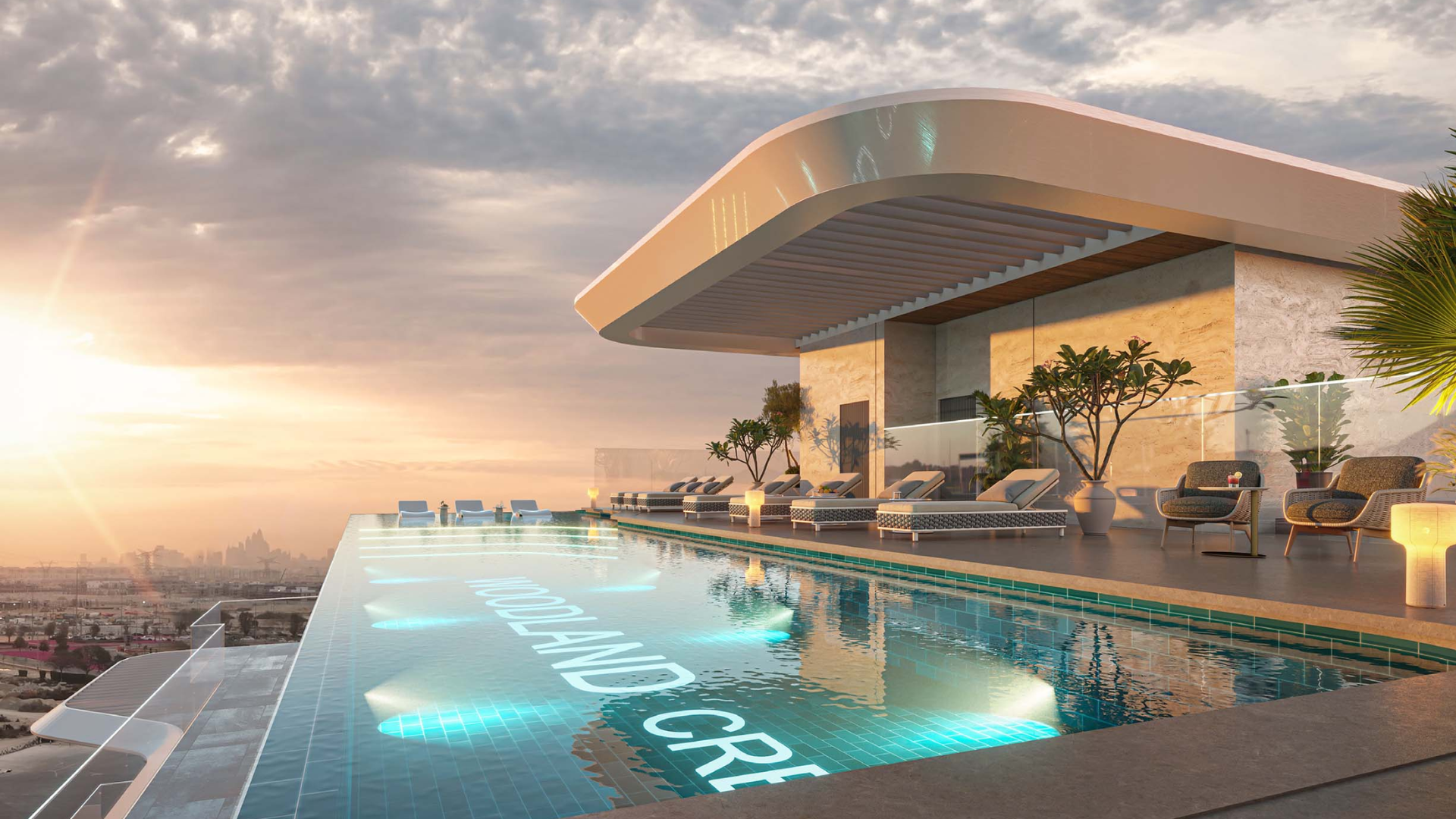 Infinity rooftop pool with lounge chairs and sunset view