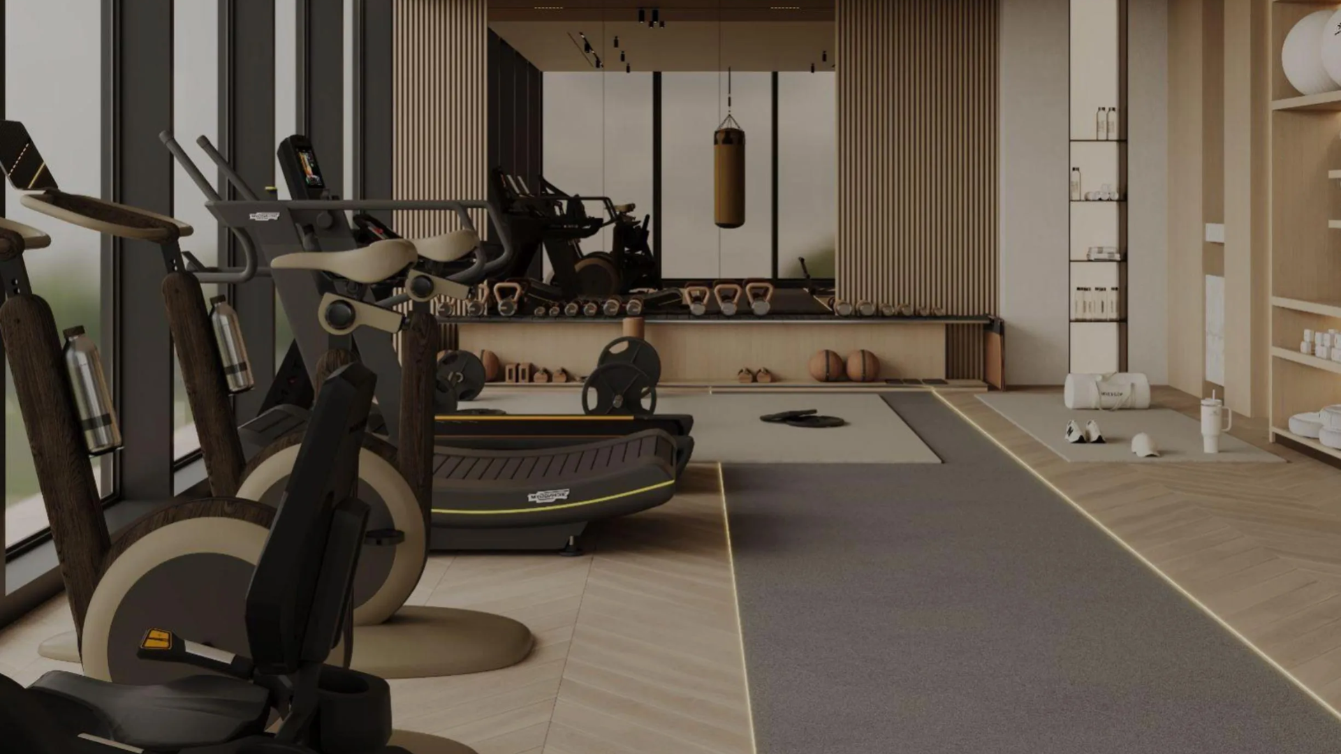 Fully equipped modern gym with floor-to-ceiling windows .