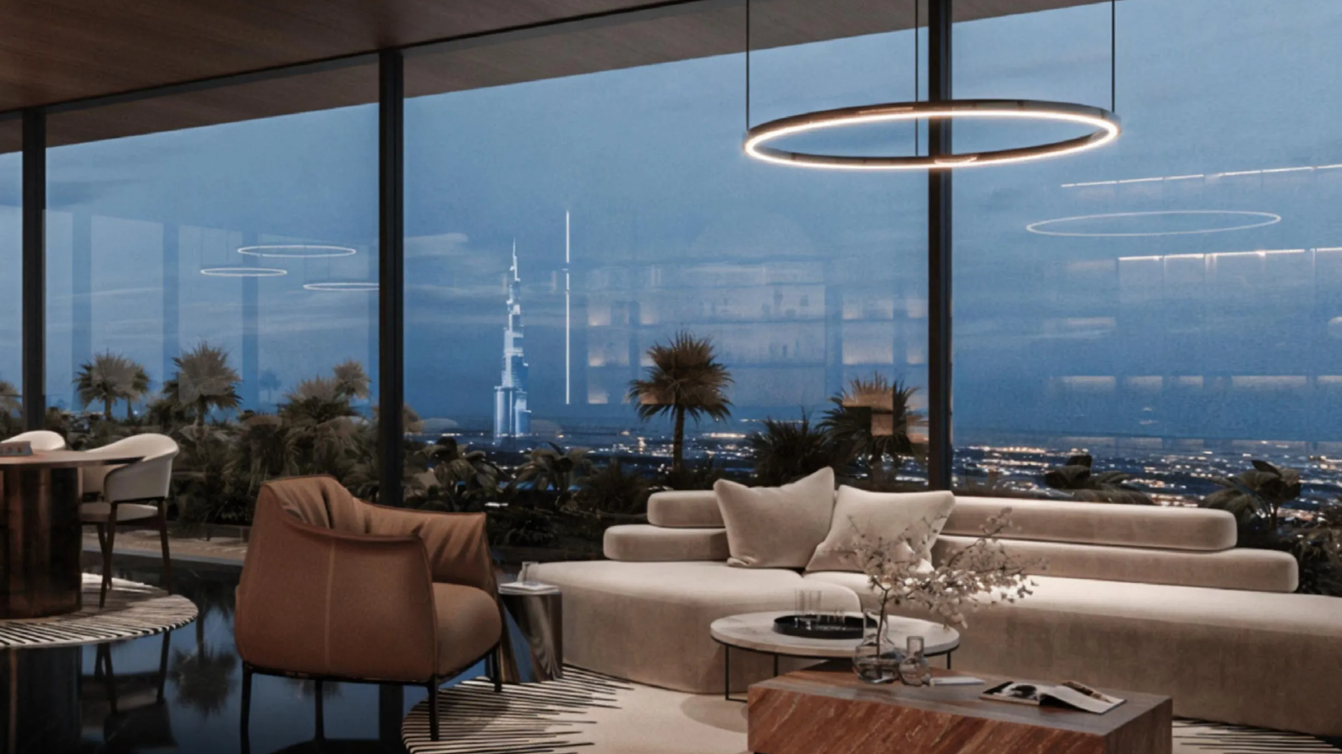 Contemporary living space with a city skyline visible at night.