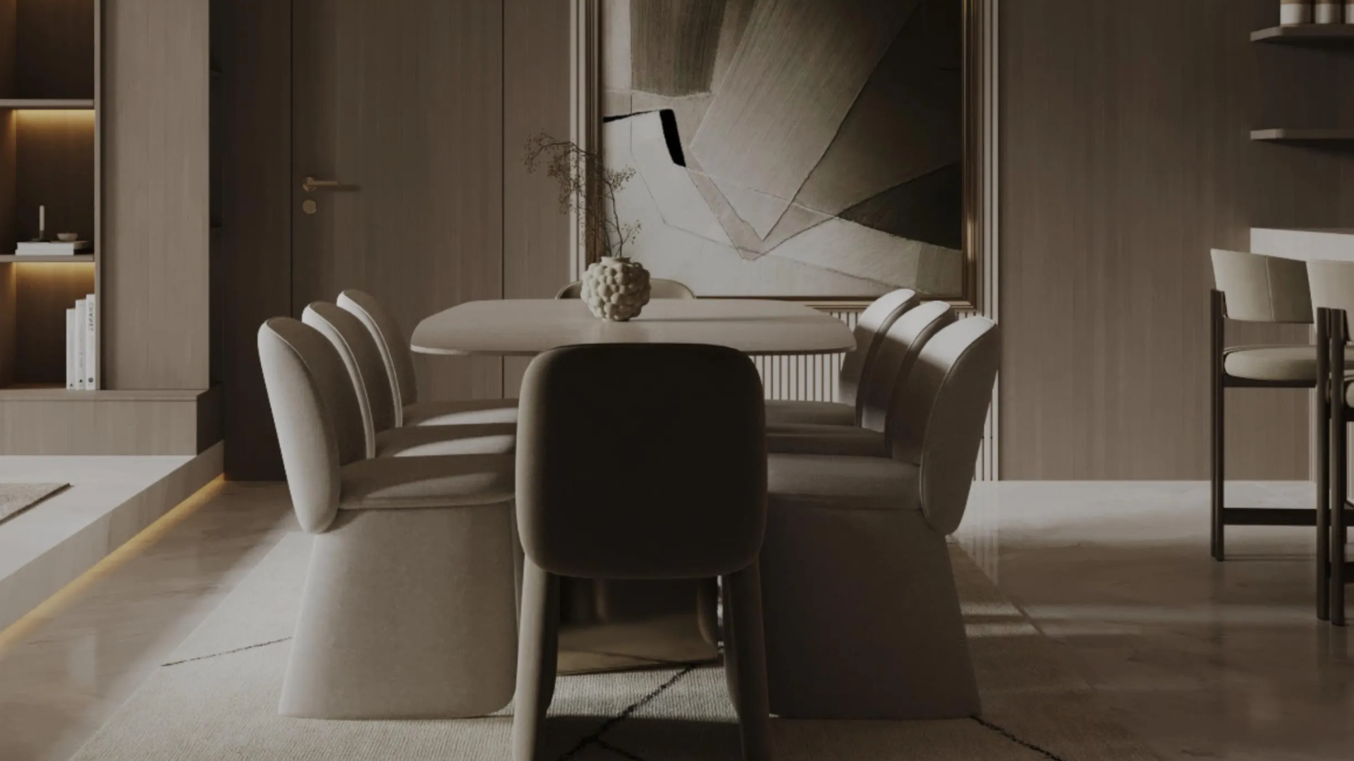A modern dining area with an oval table and plush chairs.