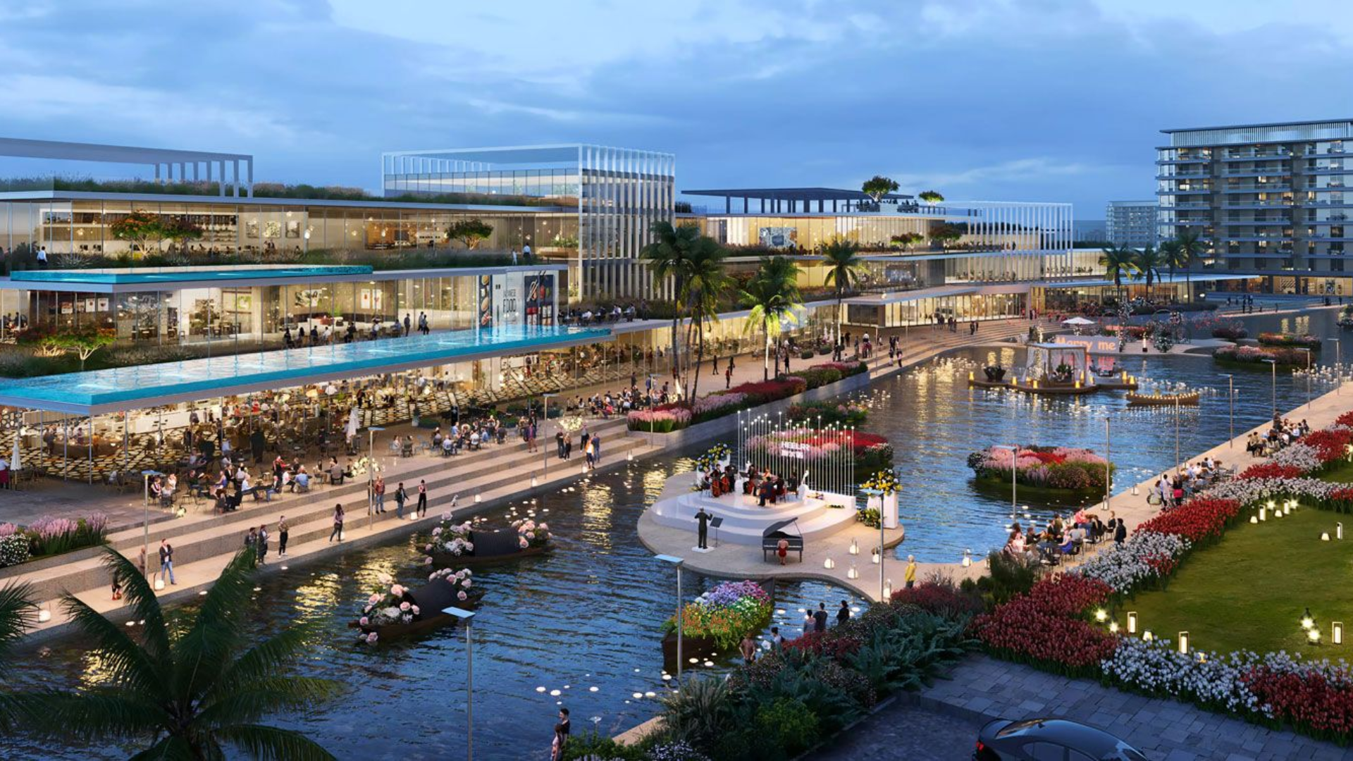 A scenic view of the waterfront promenade and landscaped gardens at DAMAC Riverside, with residents enjoying a leisurely stroll