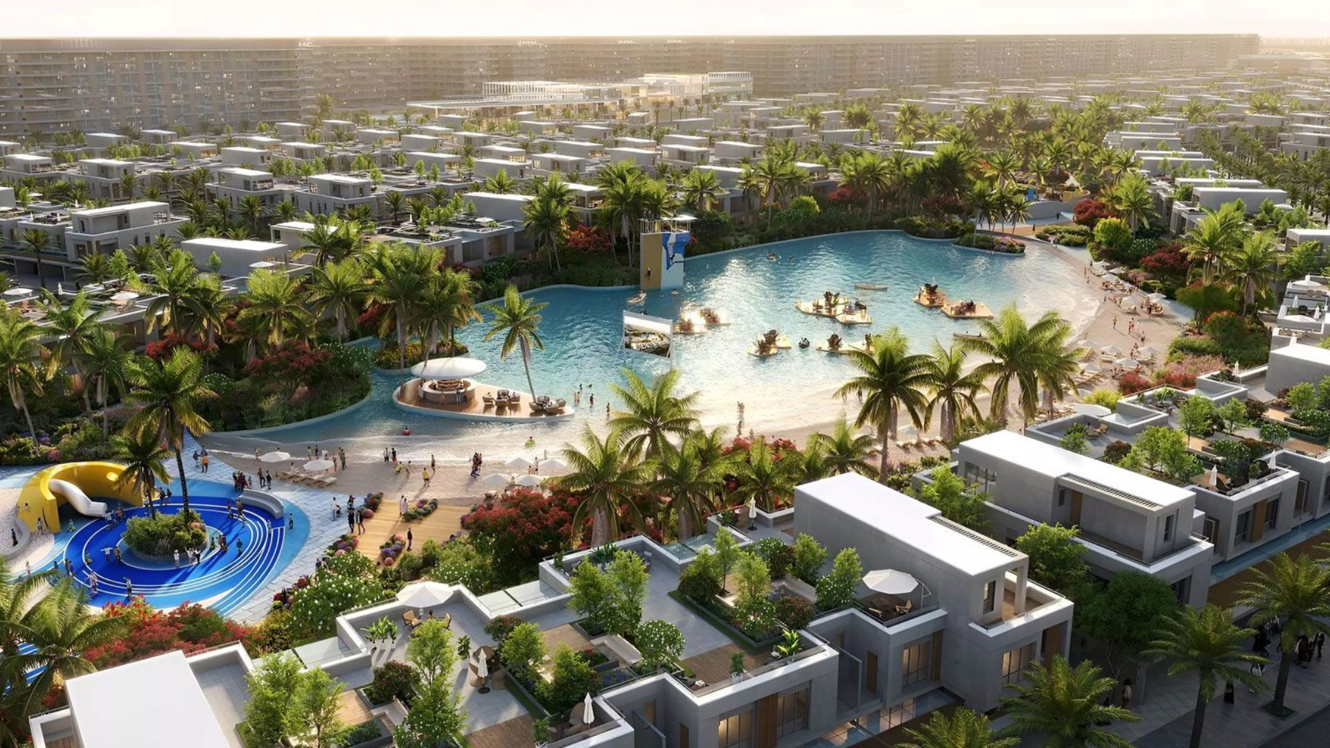 An aerial view showing the master-planned DAMAC Riverside community, showcasing the themed clusters and lush green surroundings.