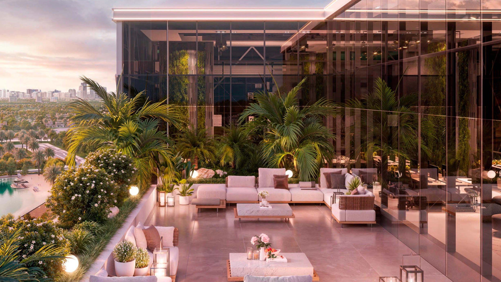 Rooftop terrace with lounge seating and lush greenery overlooking the city skyline and a lagoon