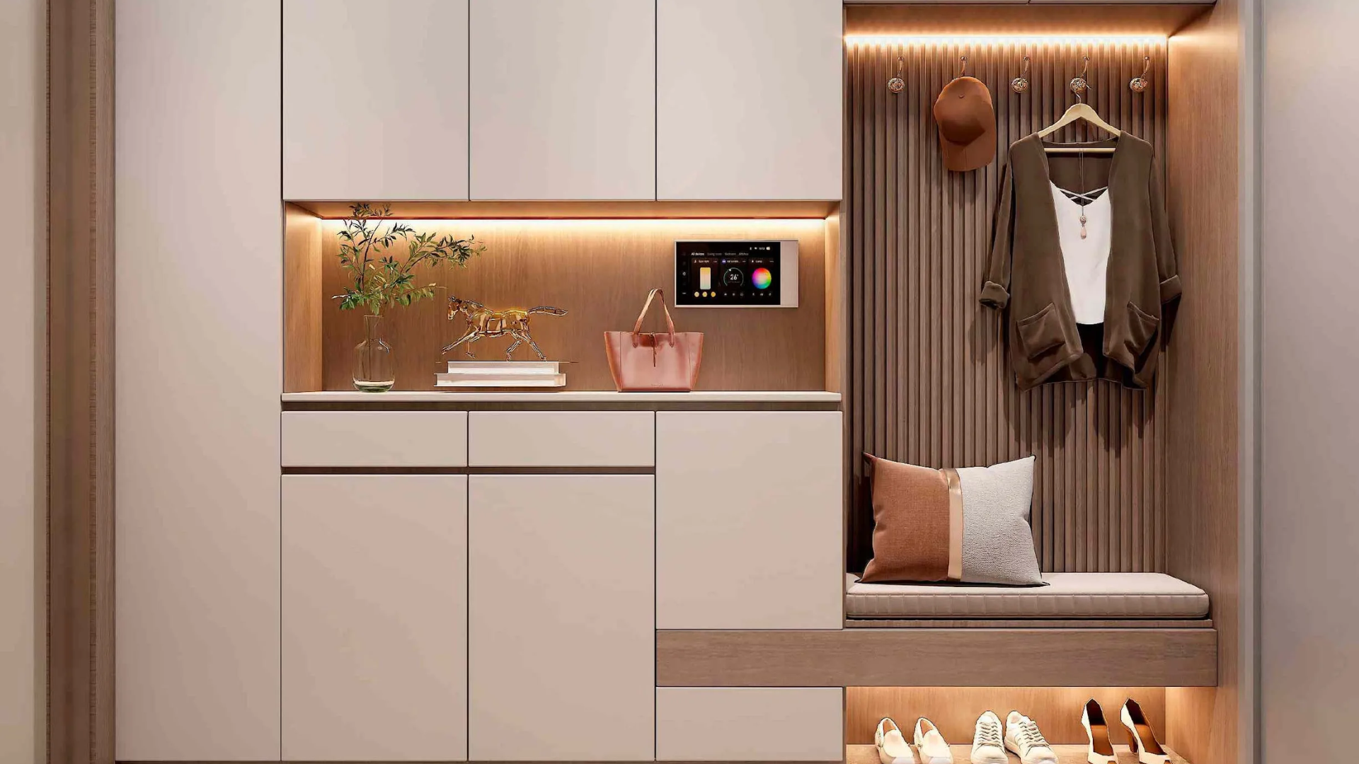 A modern entryway with a built-in cabinet, smart home tablet, coat hooks, and shoe storage