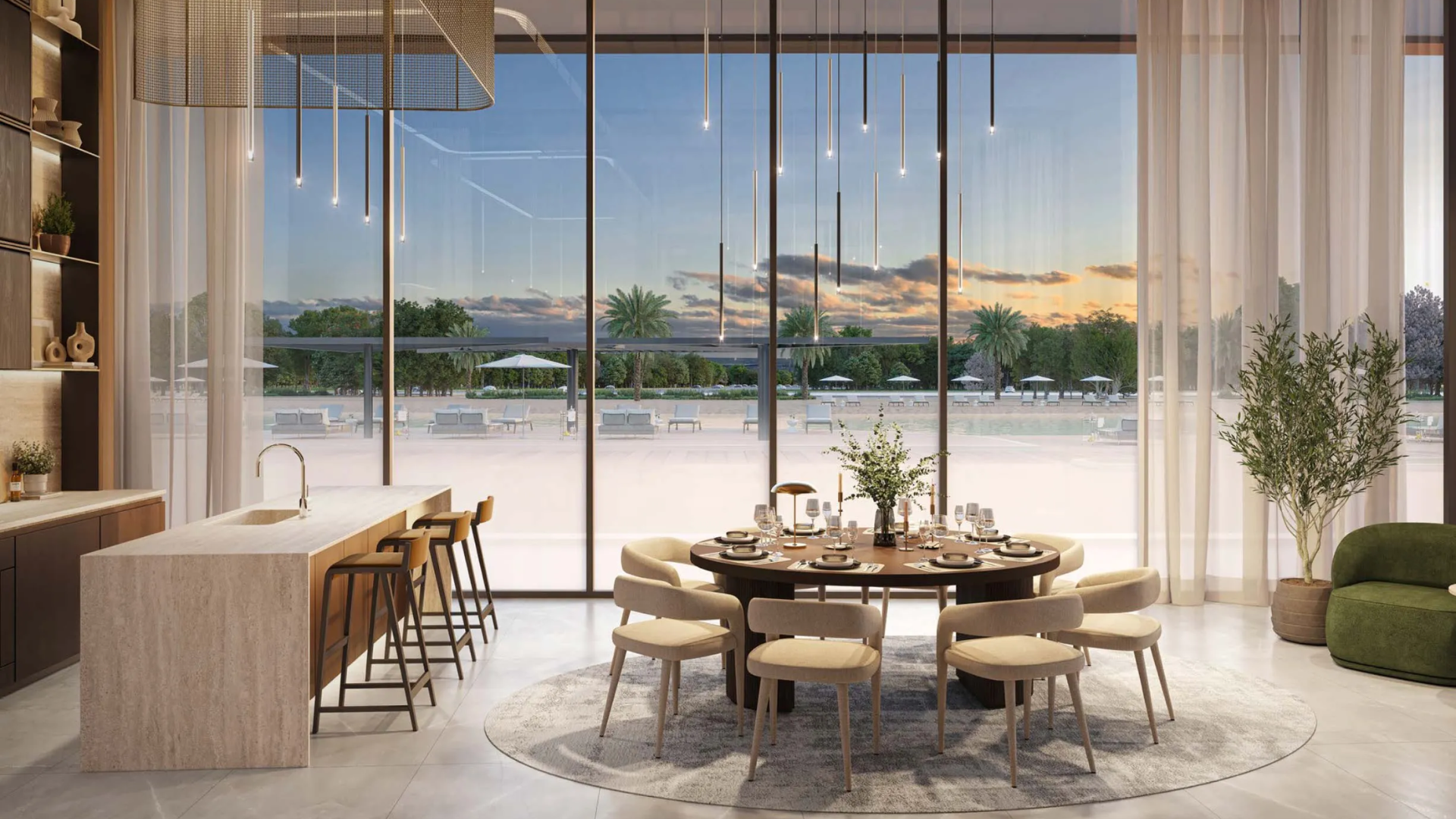 Bright modern dining area with round table and floor-to-ceiling windows overlooking outdoor lounge.