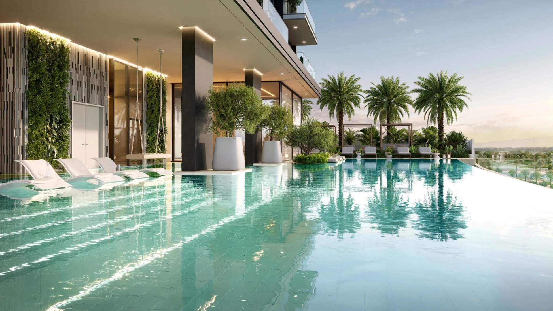 Luxury outdoor swimming pool with lounge chairs and greenery