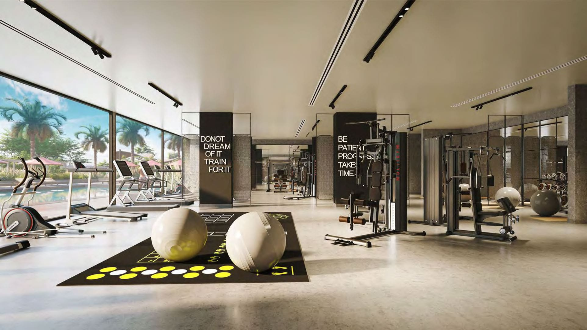 Bright fitness facility with large mirrors, professional equipment, and open training space.