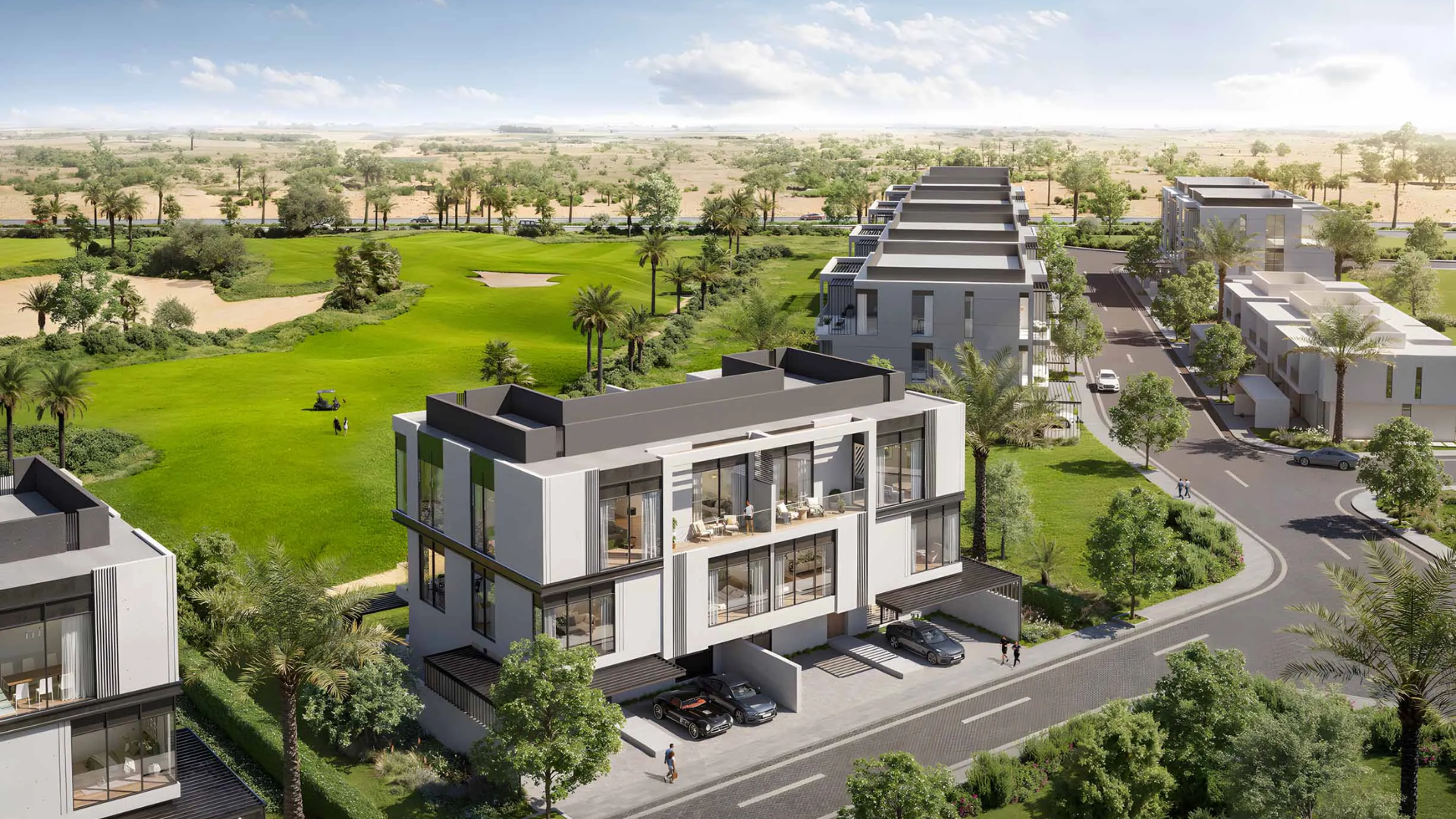 Aerial view of modern townhouses overlooking golf course and greenery