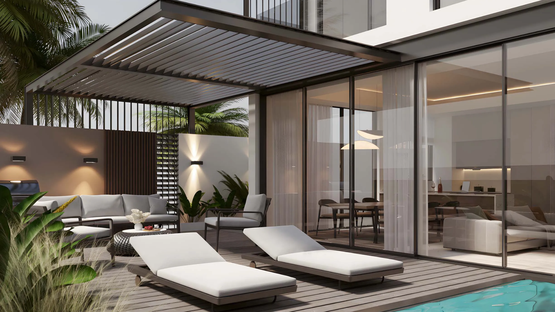 Outdoor lounge with sunbeds and poolside seating area