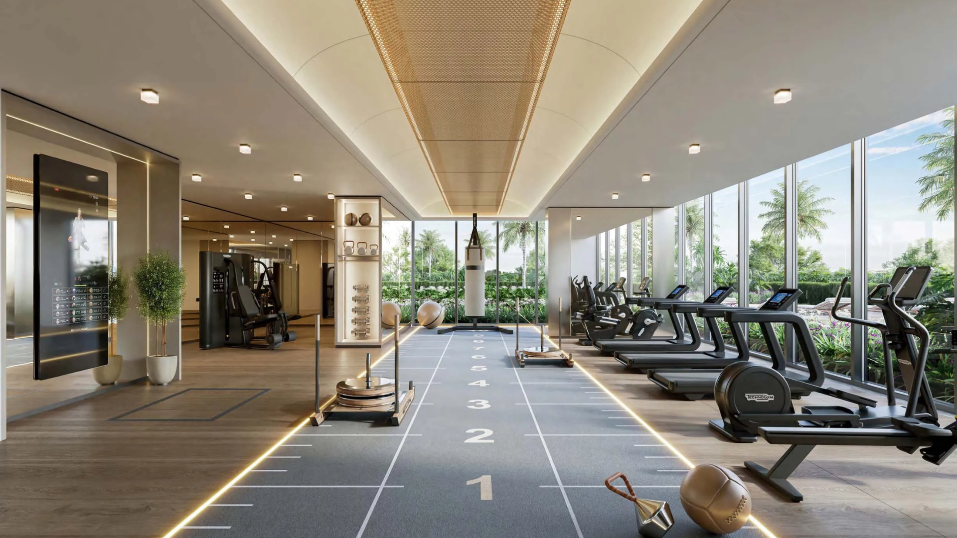 Modern gym with cardio machines, training equipment, and large windows