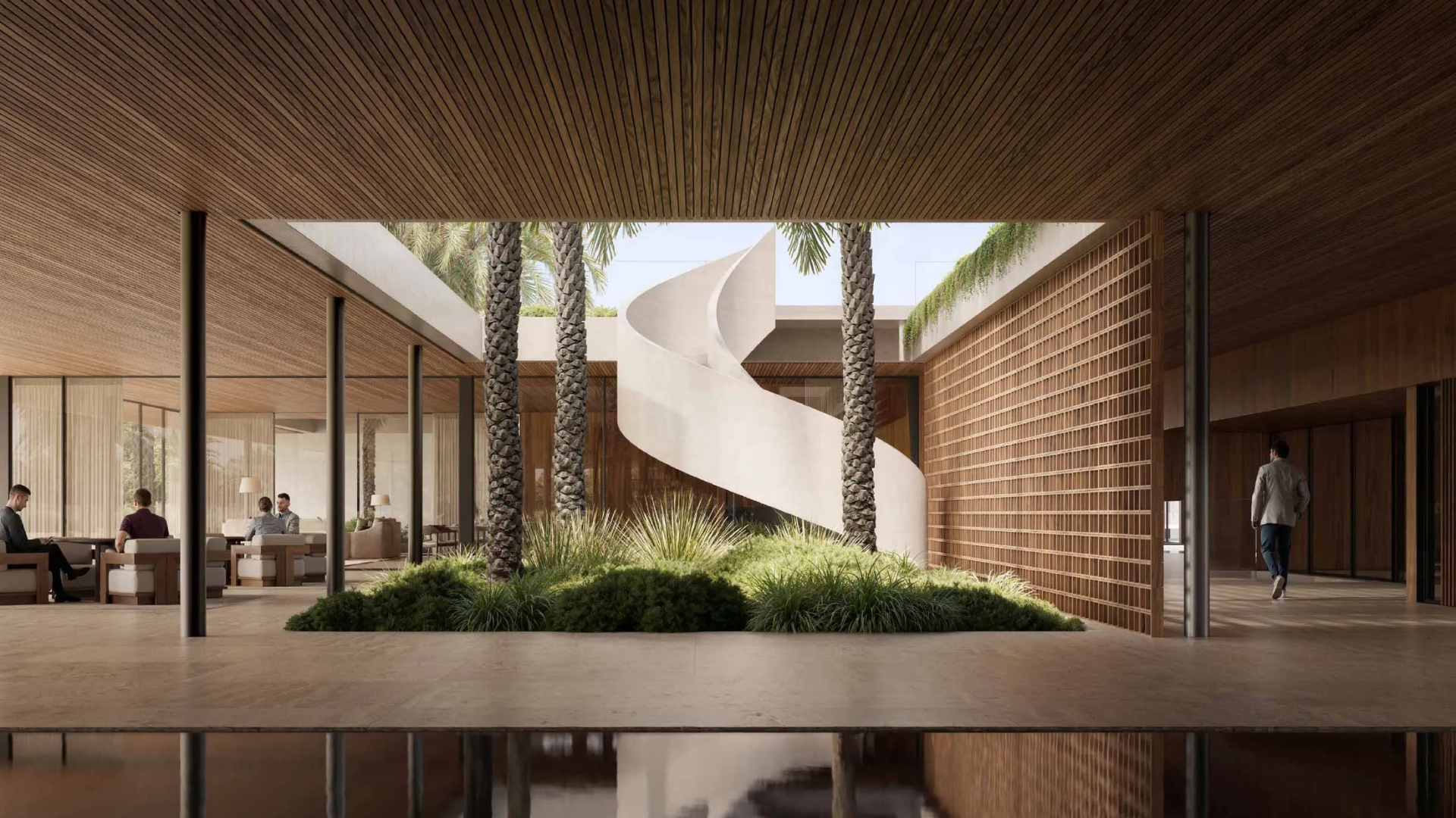 An elegant building lobby with a distinctive winding staircase, large pillars, and natural greenery.