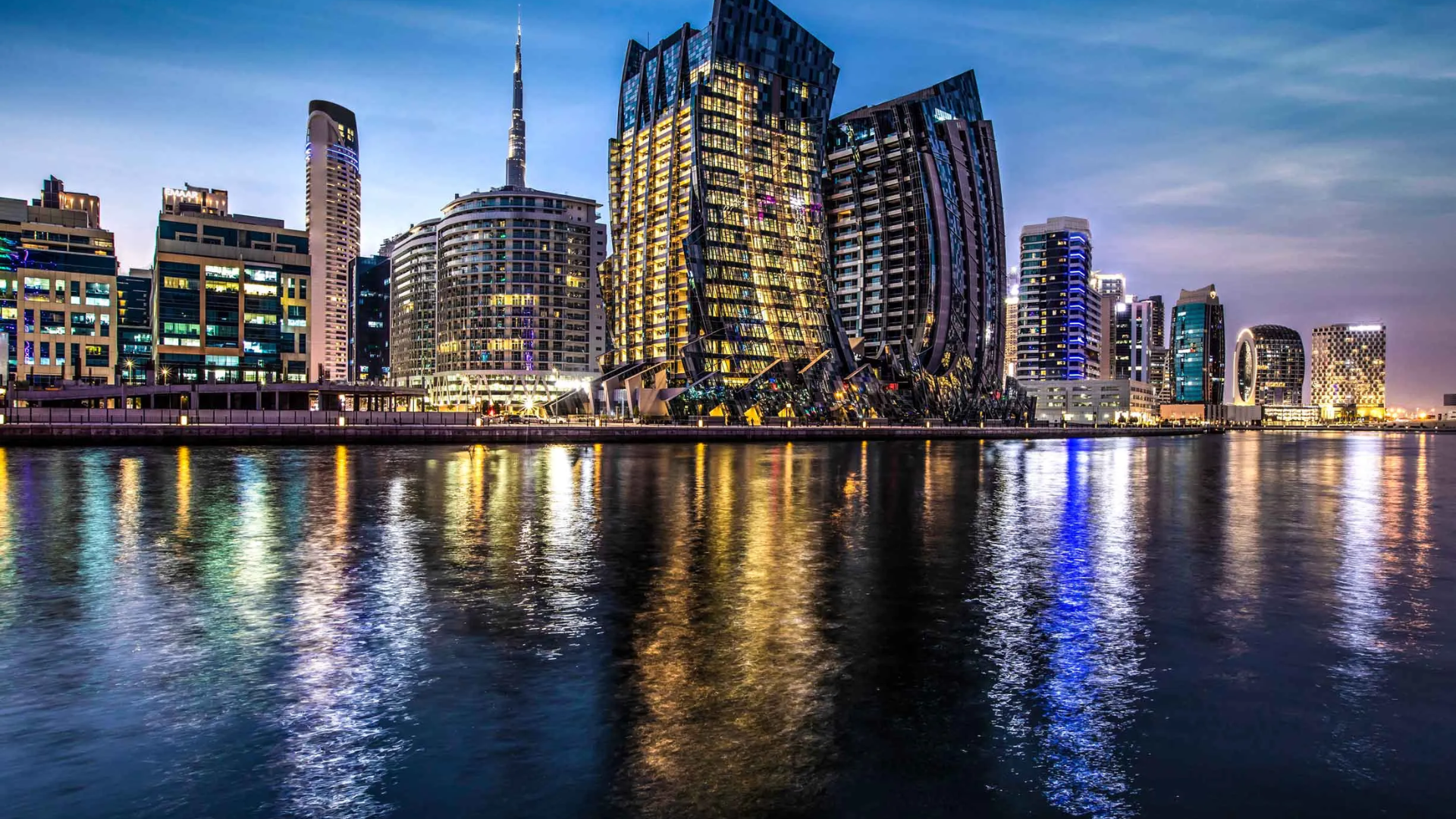 An evening view of the DaVinci Tower, a prominent architectural landmark in the Business Bay skyline.