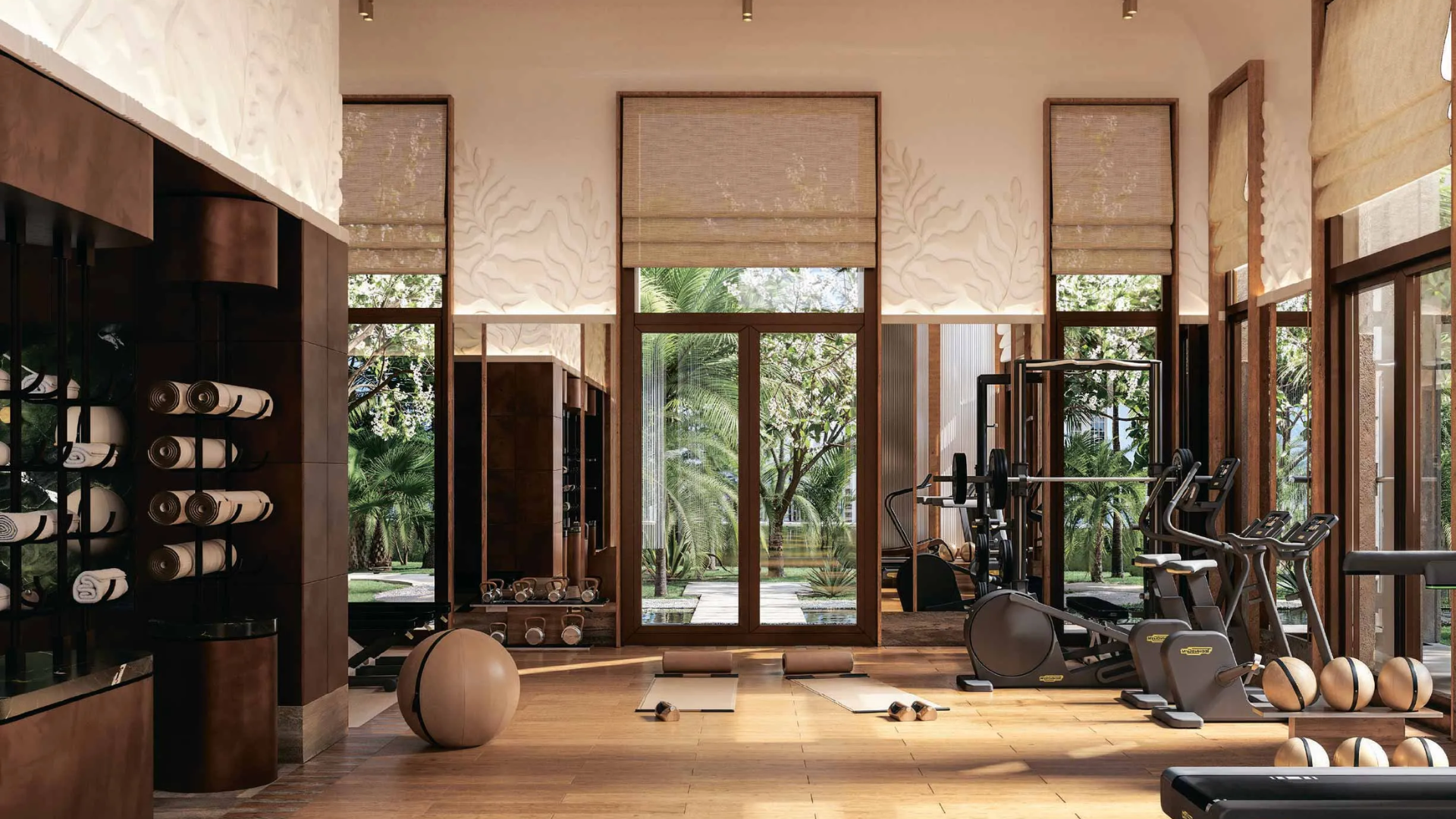 Modern fitness and wellness center with exercise equipment overlooking landscaped gardens.