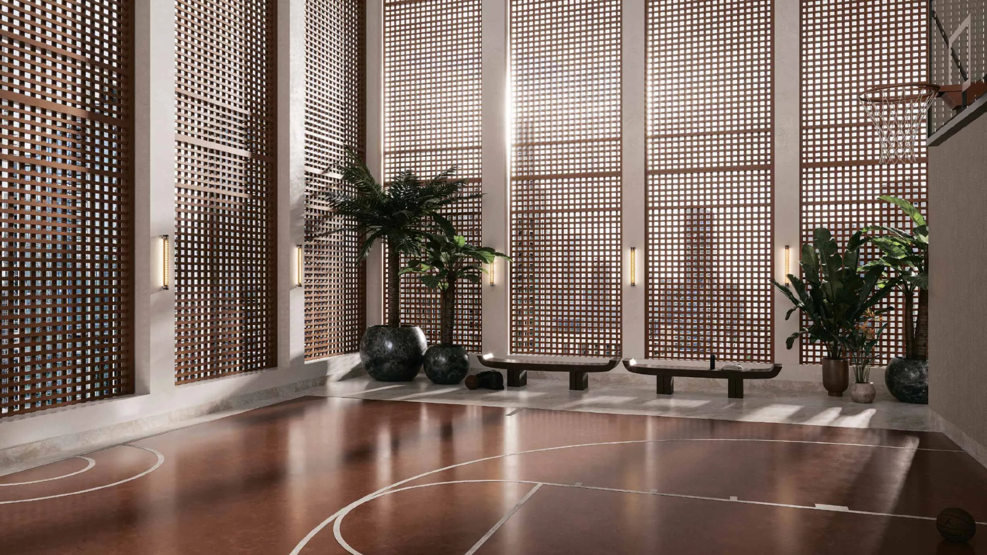 A modern indoor basketball court with elegant wooden lattice windows and a polished floor.
