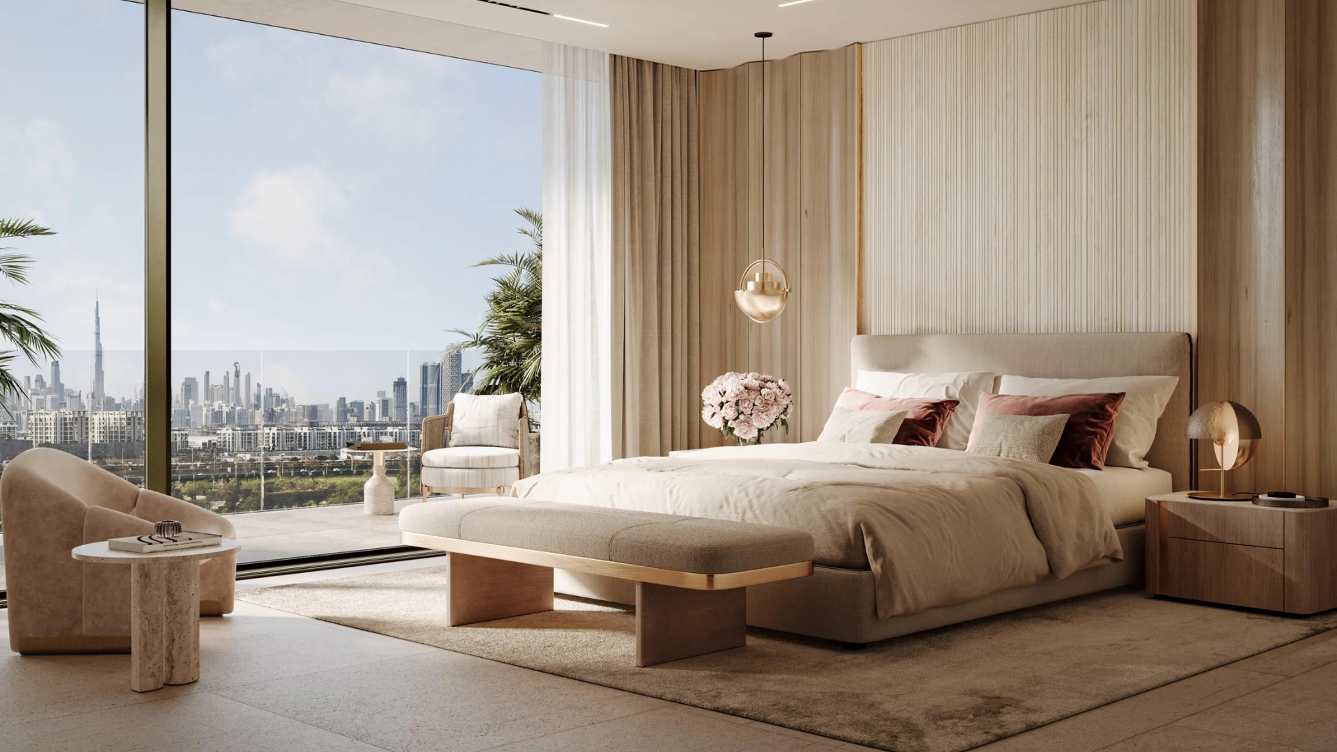 Bright interior space with a large bed, lounge chairs, and a view of skyscrapers, including the Burj Khalifa.