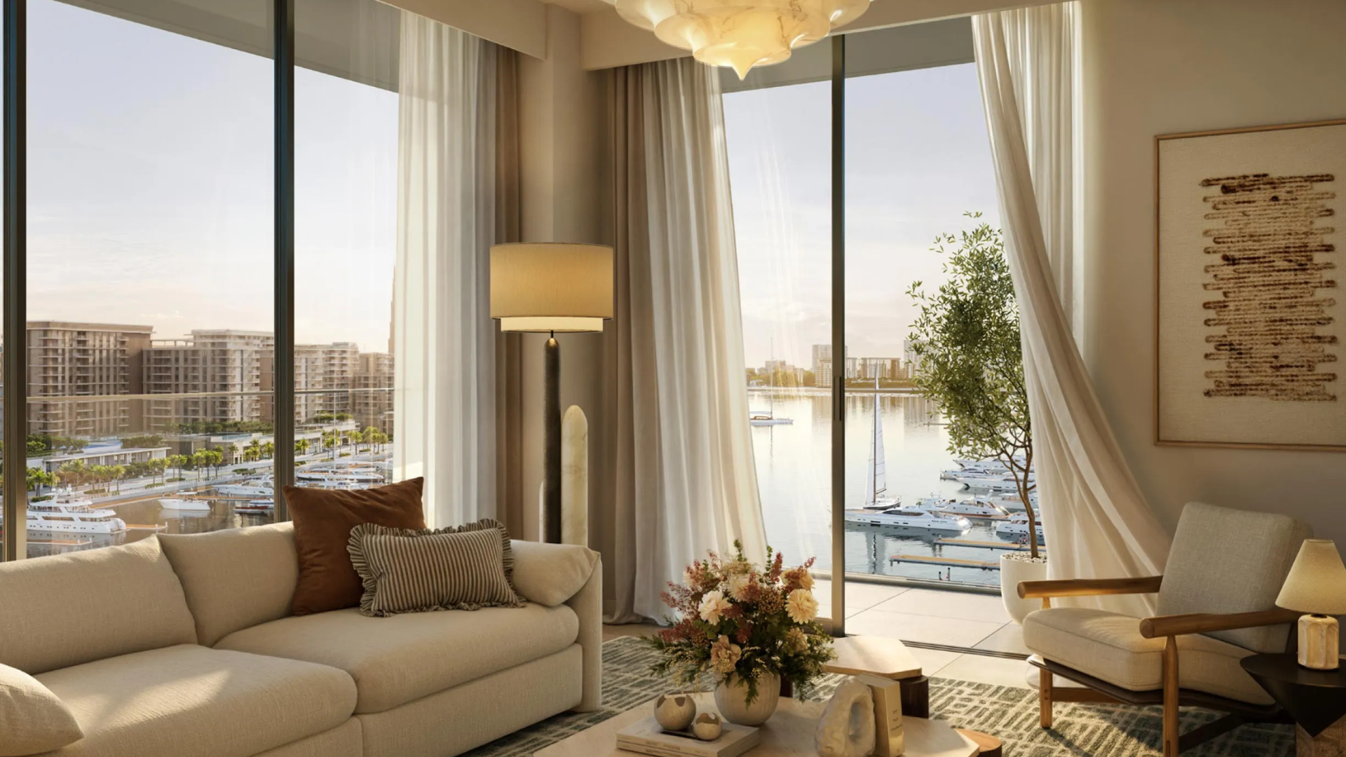 Modern apartment living room with a neutral sofa and floor-to-ceiling windows overlooking the waterfront.