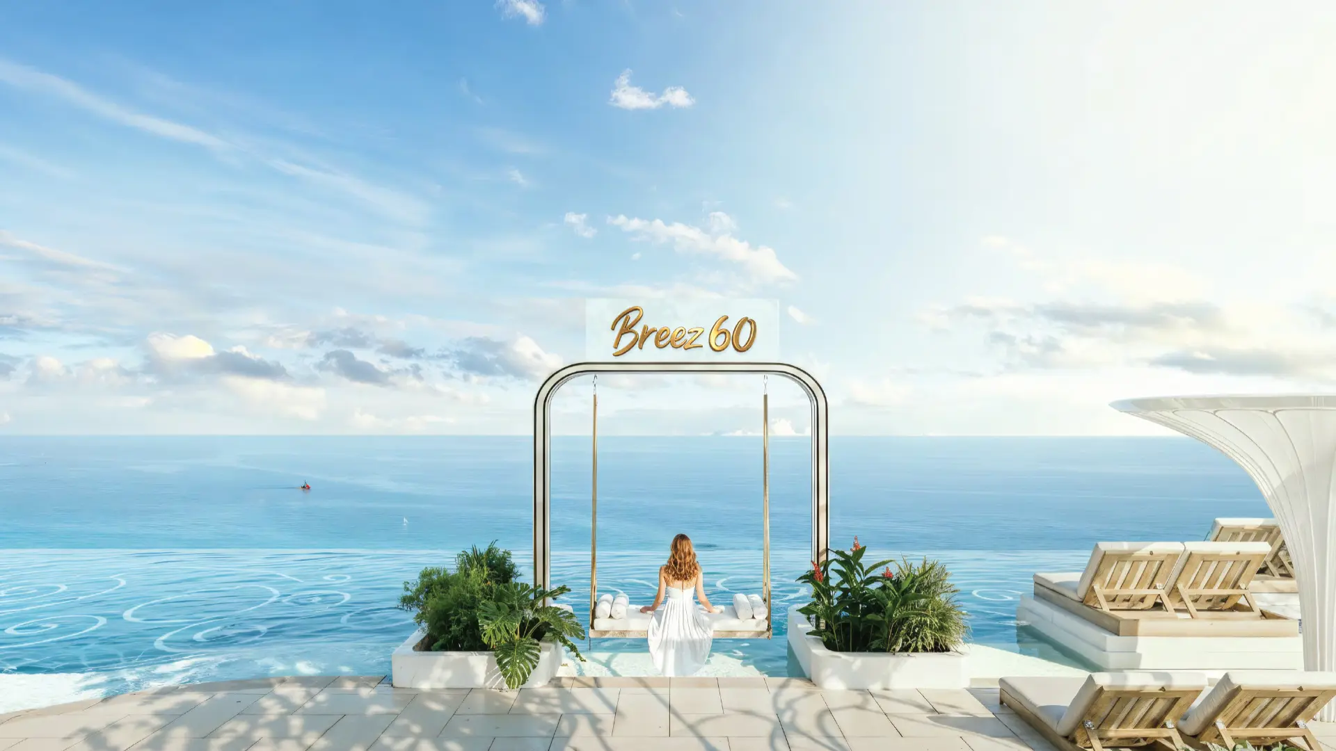 Luxury amenity area featuring an outdoor swing, lounge chairs, and an expansive sea view under a clear sky.