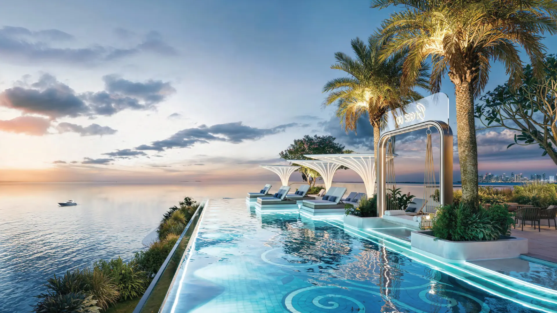 A luxurious infinity pool overlooking the ocean at sunset, surrounded by sun loungers and palm trees.
