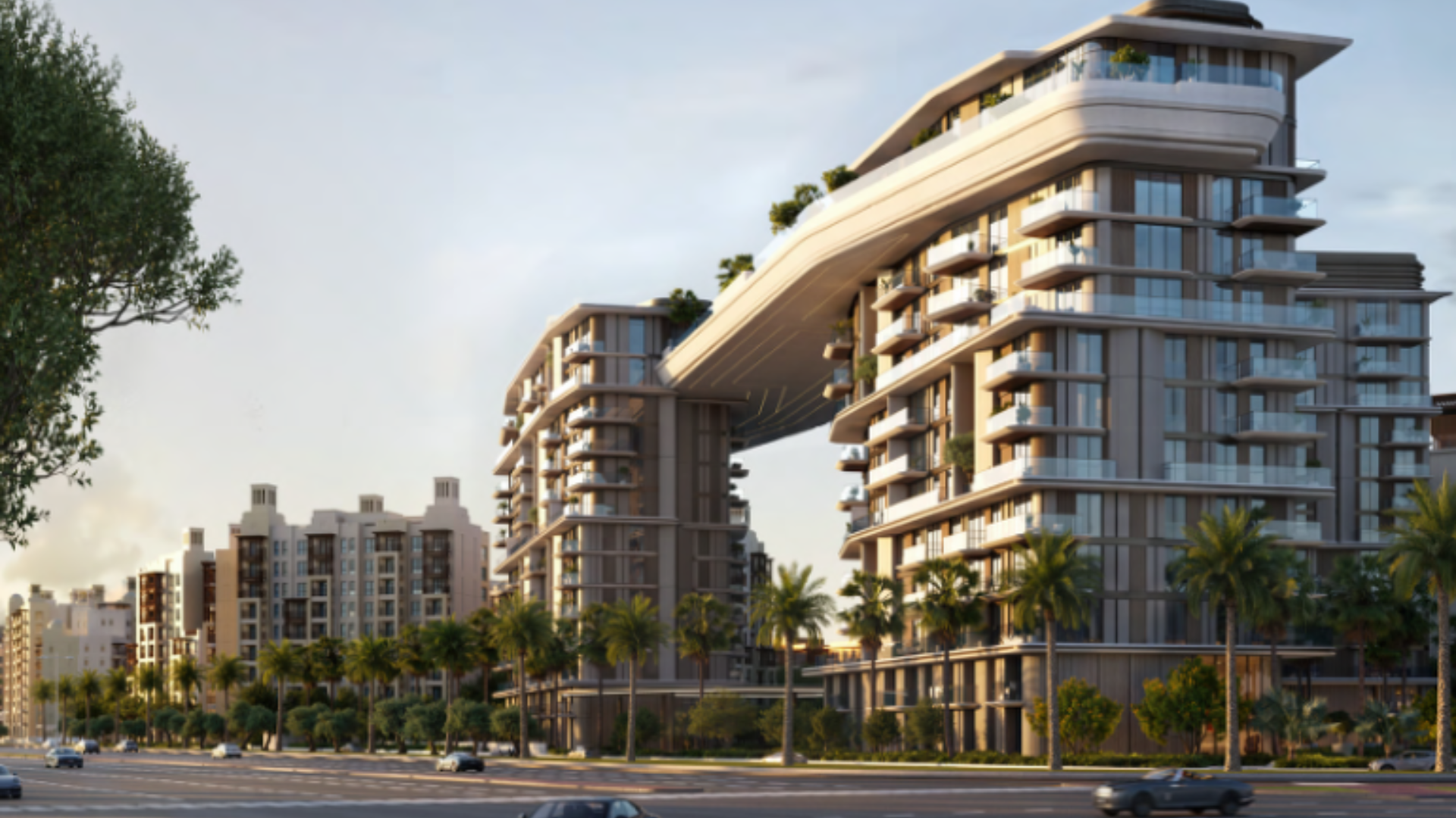 The exterior of the MJL Nourelle residential towers, connected by a striking sculptural skybridge.
