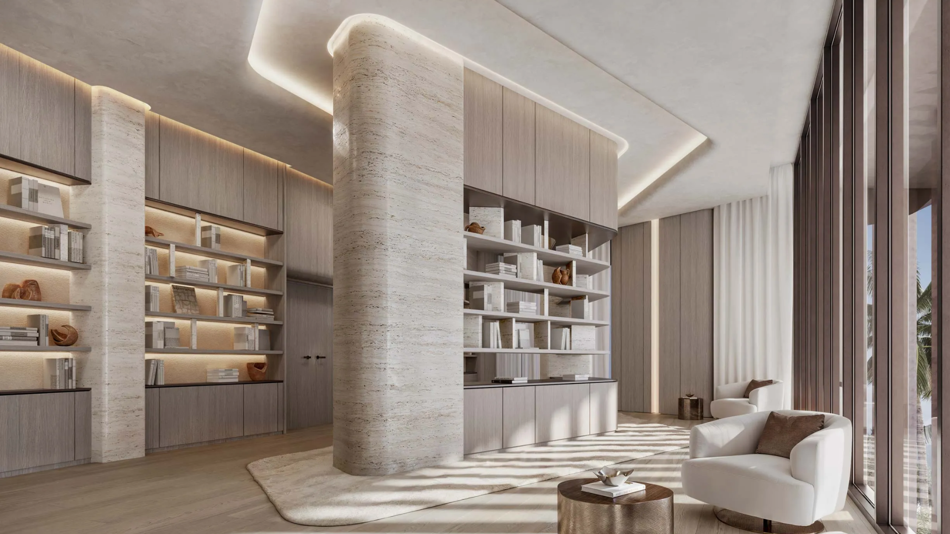 Luxurious modern library/lounge with built-in wooden shelves, recessed lighting, a curved stone column, plush white armchairs, and floor-to-ceiling windows.