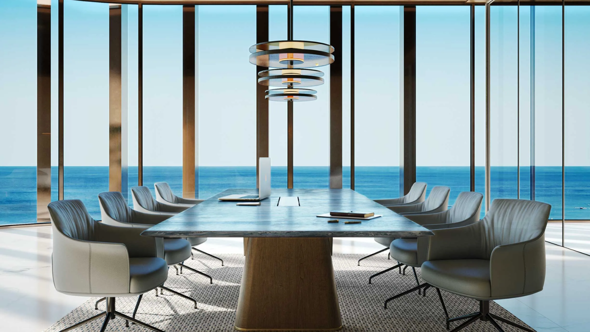 Modern conference room with marble table, stylish chairs, and panoramic ocean view through floor-to-ceiling windows.