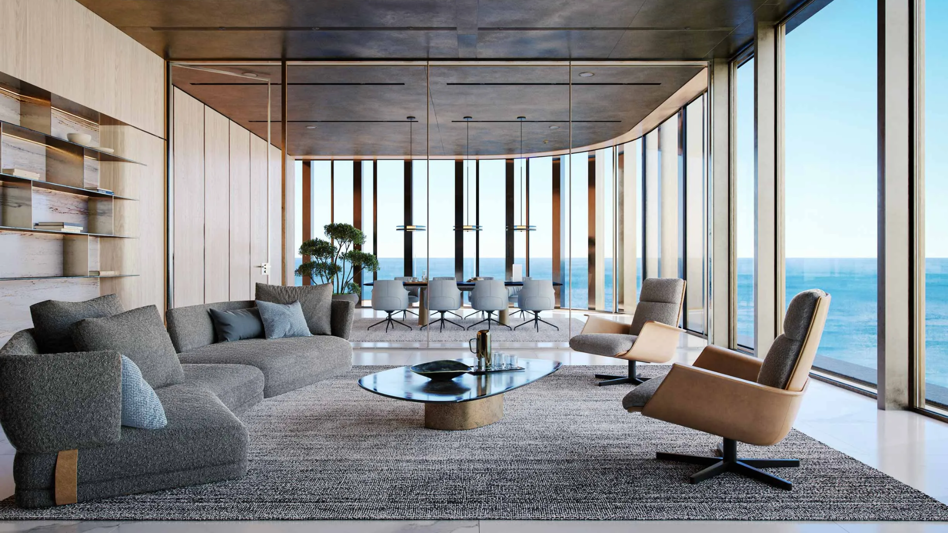 Modern living area with stylish seating and ocean view through floor-to-ceiling windows.