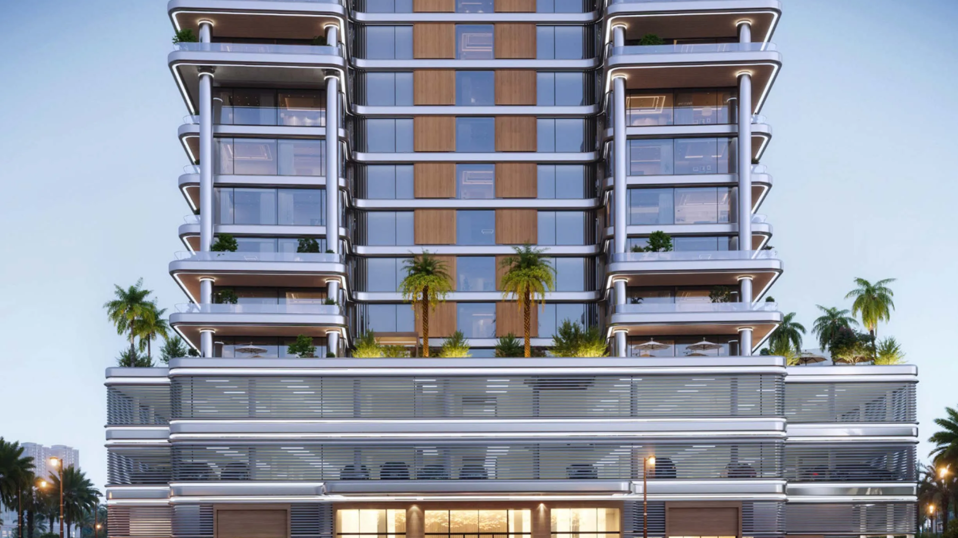 A modern high-rise with glass façades, layered balconies, and landscaped terraces with palm trees.
