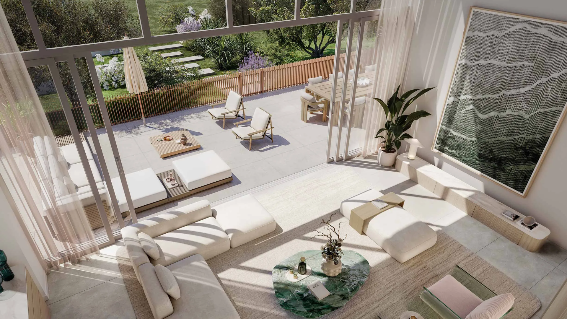 Modern living room with floor-to-ceiling windows opening to a spacious outdoor terrace featuring lounge chairs, dining area, and garden view.