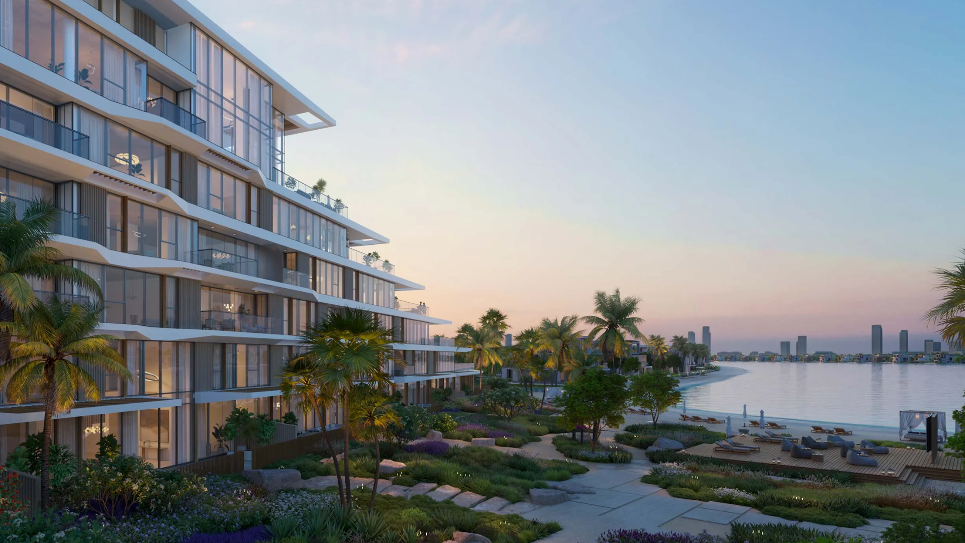 Modern beachfront residential development by Nakheel featuring contemporary architecture, glass facades, and palm-lined shore.