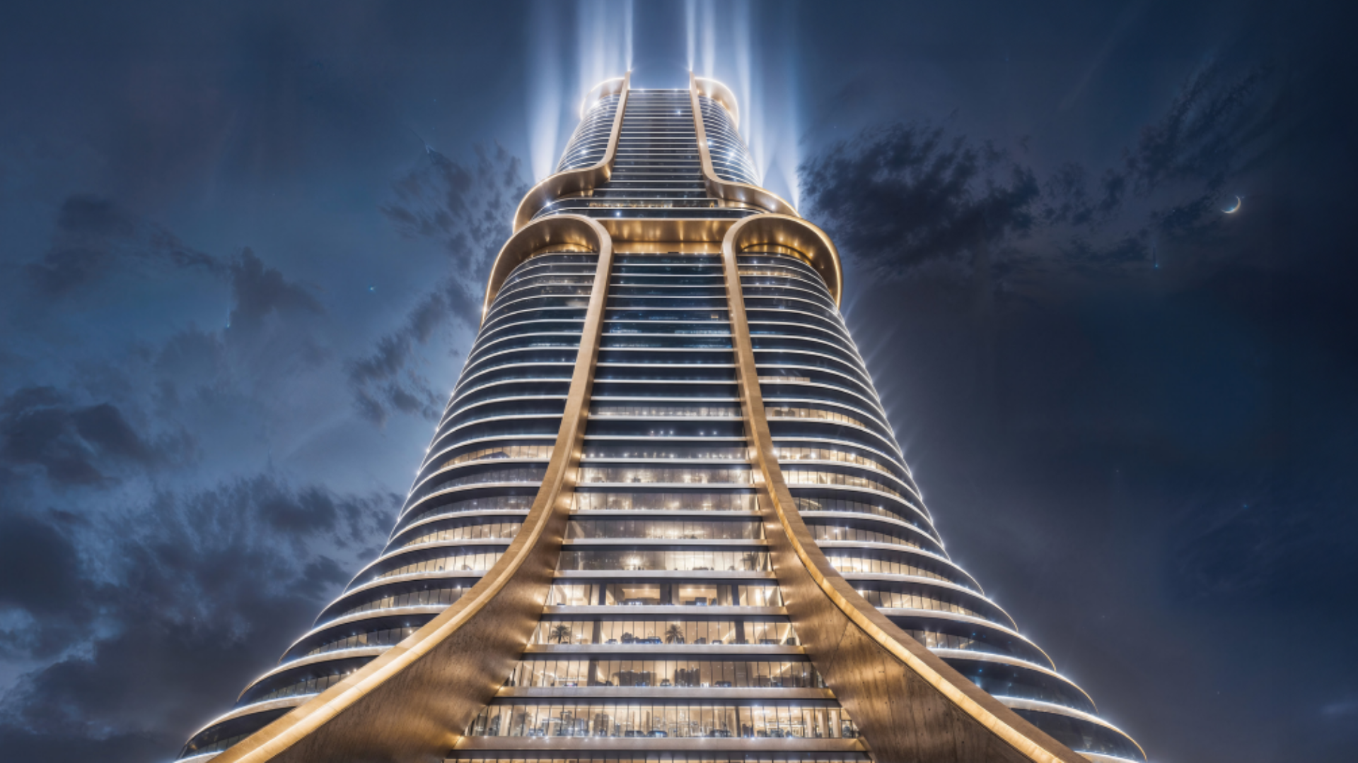 A futuristic skyscraper illuminated at night, with upward-shining lights and a unique curved architectural design .