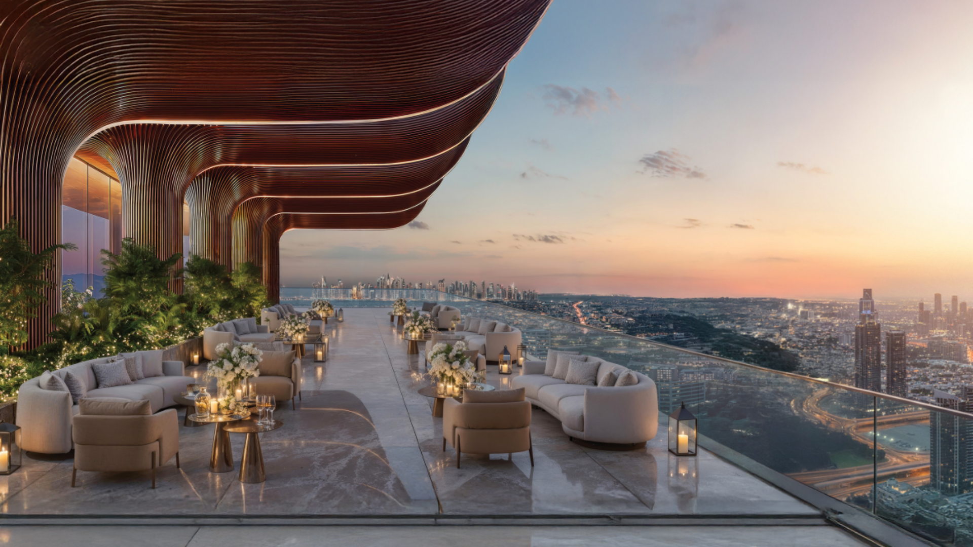A high-level amenity terrace by Danube Properties, offering dramatic curved architecture and stunning views of the urban landscape.