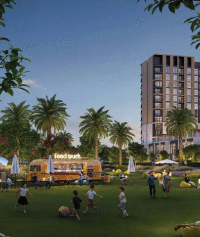 The central community park at Terra Gardens, featuring food trucks, beanbag seating, and family recreation in the evening.