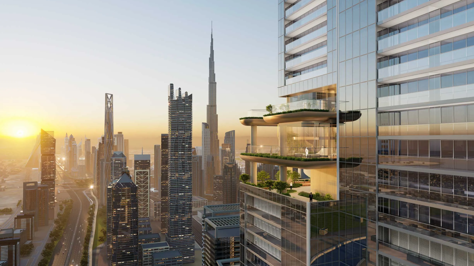 Modern high-rise building with multiple terrace gardens overlooking a city skyline at sunset.