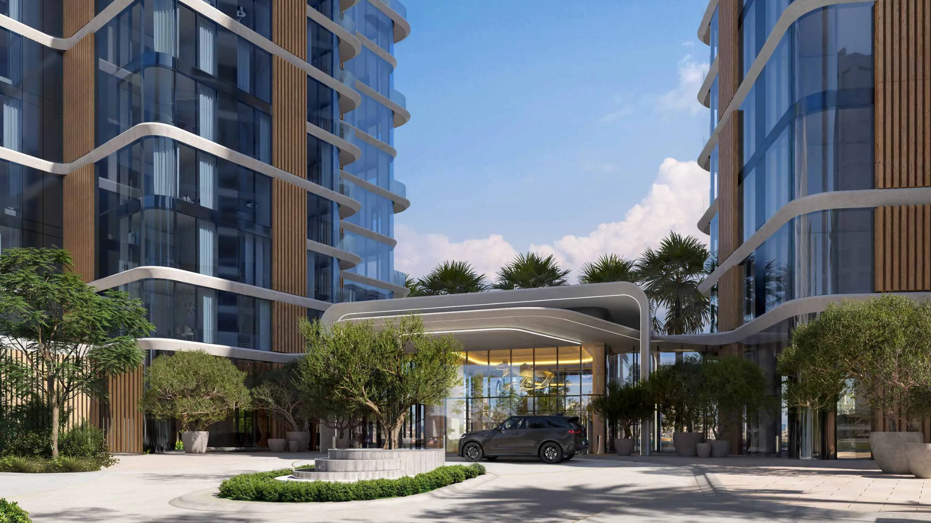 Cluster of three contemporary high-rise towers with a sculptural, faceted design next to a waterway.